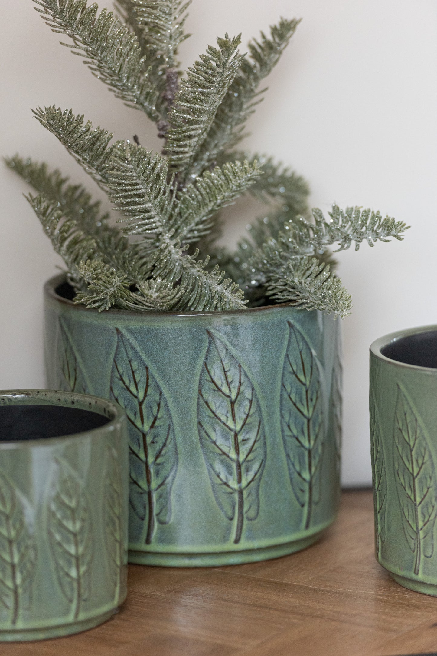 Groene bloempot met bladeren-motief